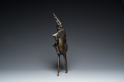 A large Chinese bronze 'Shou Lao on deer' censer, 19th C. or earlier