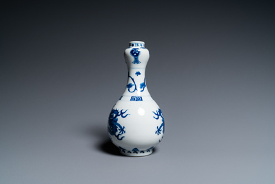 A Chinese blue and white 'dragons' bottle vase, Jiajing mark, 19/20th C.