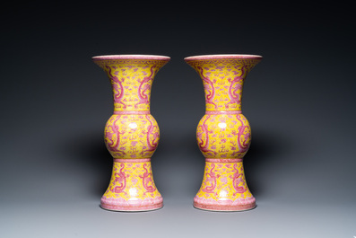 A pair of Chinese puce-enamelled yellow-ground 'gu' vases with dragons, Jia Xu Nian Zhi 甲戌年製 mark, dated 1874