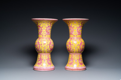 A pair of Chinese puce-enamelled yellow-ground 'gu' vases with dragons, Jia Xu Nian Zhi 甲戌年製 mark, dated 1874