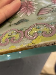 A pair of Chinese famille rose celadon-ground vases, 19th C.