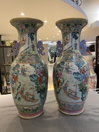 A pair of Chinese famille rose celadon-ground vases, 19th C.