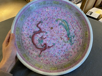 A pair of large Chinese pink-ground famille rose 'dragon and phoenix' dishes, 19th C.