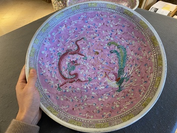 A pair of large Chinese pink-ground famille rose 'dragon and phoenix' dishes, 19th C.