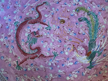 A pair of large Chinese pink-ground famille rose 'dragon and phoenix' dishes, 19th C.