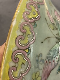 A pair of Chinese famille rose celadon-ground vases, 19th C.