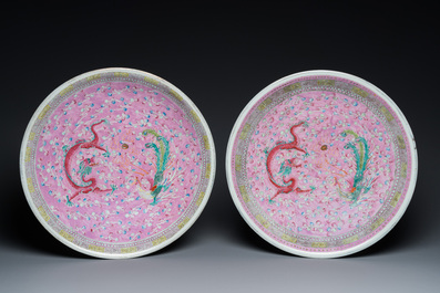 A pair of large Chinese pink-ground famille rose 'dragon and phoenix' dishes, 19th C.