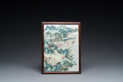 A Chinese famille rose plaque mounted as a table screen, Qianlong