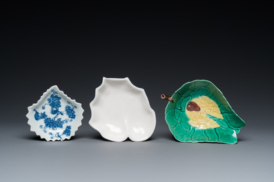 Three Chinese leaf-shaped brush washers in blue and white, blanc de Chine and sancai enamels, 18/19th C.