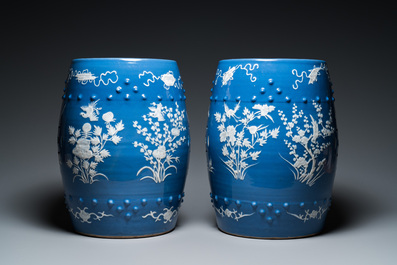 A pair of Chinese white slip-decorated blue-ground garden seats, 19th C.