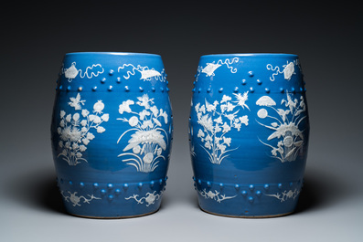 A pair of Chinese white slip-decorated blue-ground garden seats, 19th C.