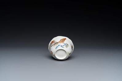 A Chinese grisaille and gilt 'roosters' cup and two saucers, Yongzheng