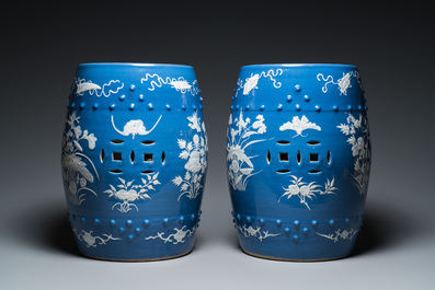 A pair of Chinese white slip-decorated blue-ground garden seats, 19th C.