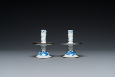 A pair of Chinese blue and white 'Bleu de Hue' candlesticks for the Vietnamese market, Kim Ngoc Cam Kee 金玉錦記 mark, 19th C.