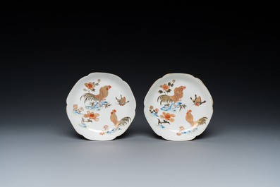 A Chinese grisaille and gilt 'roosters' cup and two saucers, Yongzheng