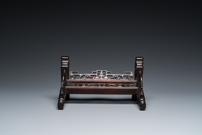 A Chinese famille rose plaque mounted as a table screen, Qianlong