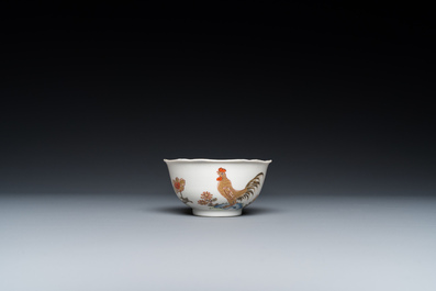 A Chinese grisaille and gilt 'roosters' cup and two saucers, Yongzheng