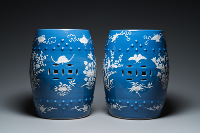 A pair of Chinese white slip-decorated blue-ground garden seats, 19th C.
