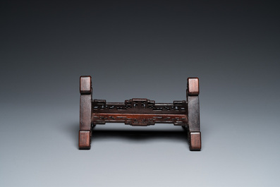 A Chinese famille rose plaque mounted as a table screen, Qianlong