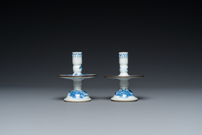 A pair of Chinese blue and white 'Bleu de Hue' candlesticks for the Vietnamese market, Kim Ngoc Cam Kee 金玉錦記 mark, 19th C.