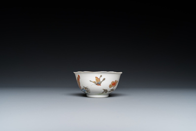 A Chinese grisaille and gilt 'roosters' cup and two saucers, Yongzheng