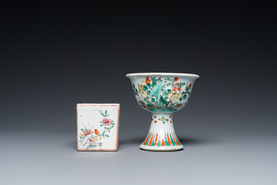 A Chinese famille verte stem cup, a famille rose 'mandarin' sander and a knife handle, Kangxi/Qianlong