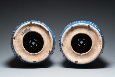 A pair of Chinese white slip-decorated blue-ground garden seats, 19th C.
