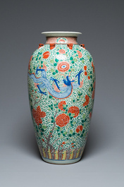 A very large Chinese famille verte 'dragon' vase on wooden stand, 19th C.