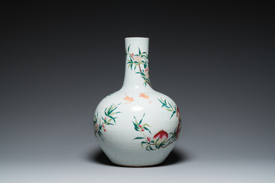A Chinese famille rose 'nine peaches' bottle vase, Qianlong mark, 19th C.