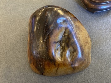A Chinese hollowed jade libation cup on wooden stand, probably Qing