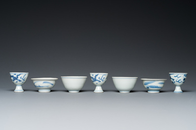 Four Chinese blue and white 'Hatcher cargo' bowls and three stem cups, Transitional period