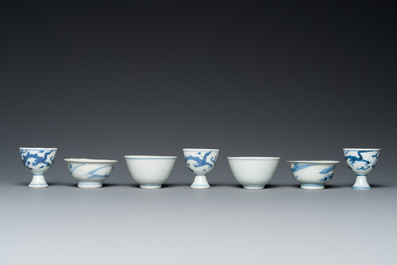 Four Chinese blue and white 'Hatcher cargo' bowls and three stem cups, Transitional period