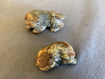Two Chinese celadon and russet jade Buddhist lion sculptures, Qing