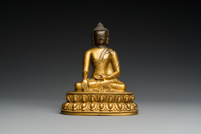 A Sino-Tibetan gilt bronze Buddha, 18th C.