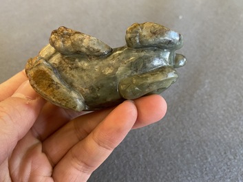 Two Chinese celadon and russet jade Buddhist lion sculptures, Qing