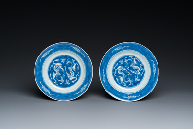A Chinese blue and white 'cranes' vase and a pair of plates, Kangxi