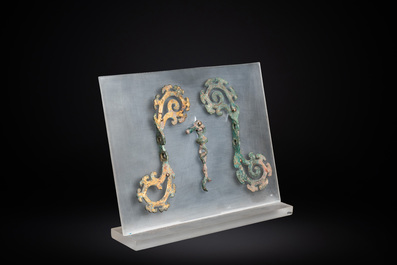 A pair of Chinese gilt bronze bridle ornaments, probably Han
