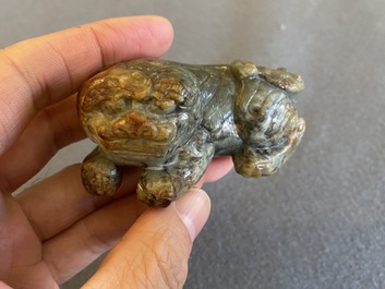 Two Chinese celadon and russet jade Buddhist lion sculptures, Qing