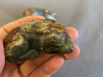 Two Chinese celadon and russet jade Buddhist lion sculptures, Qing