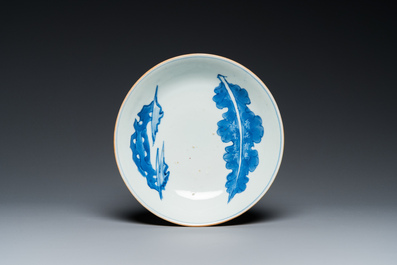 A fine Chinese blue and white 'leaf and scholar&rsquo;s rock' plate, Shunzhi