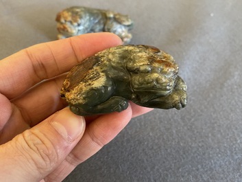 Two Chinese celadon and russet jade Buddhist lion sculptures, Qing