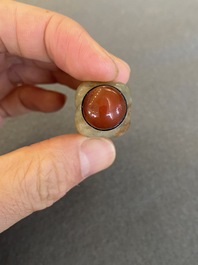 A Chinese celadon and russet jade 'cong' snuff bottle, probably Qing