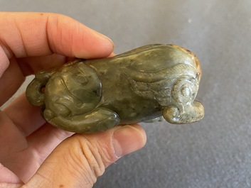 Two Chinese celadon and russet jade Buddhist lion sculptures, Qing