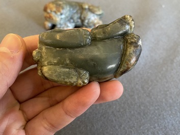 Two Chinese celadon and russet jade Buddhist lion sculptures, Qing