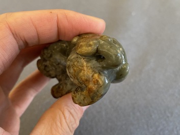 Two Chinese celadon and russet jade Buddhist lion sculptures, Qing