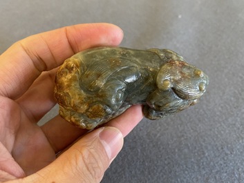 Two Chinese celadon and russet jade Buddhist lion sculptures, Qing