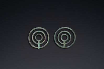 A pair of Chinese bronze bridle ornaments, Western Zhou, ca. 8th C. b.C.