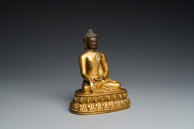 A Sino-Tibetan gilt bronze Buddha, 18th C.
