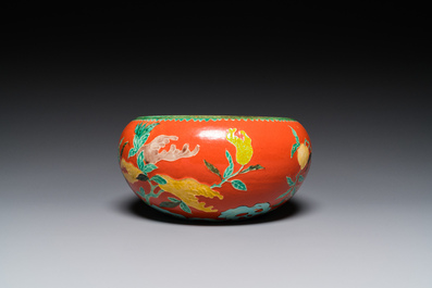 A Chinese relief-decorated alms bowl with wooden lid, Qianlong mark, 19/20th C.