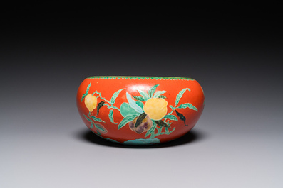 A Chinese relief-decorated alms bowl with wooden lid, Qianlong mark, 19/20th C.